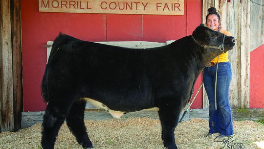 Kelsie McVicker with her Overall Grand Champion Beef
