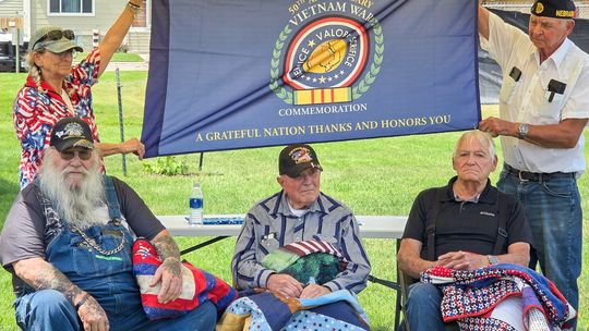 Three receive Quilts of Valor