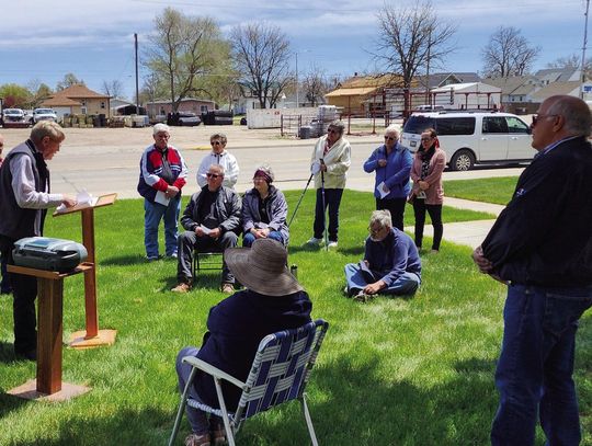 A small group gathered on the Morrill County courthouse lawn 