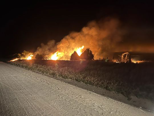 Calm winds helped minimize the spread of flames at a fire on the Kent and Bobbi Wright property southeast of Bridgeport the evening of Thursday