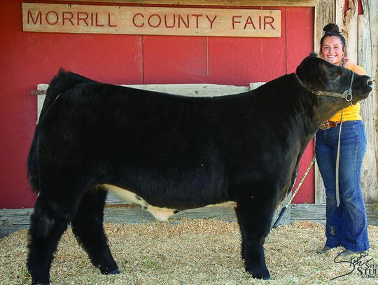 Kelsie McVicker with her Overall Grand Champion Beef