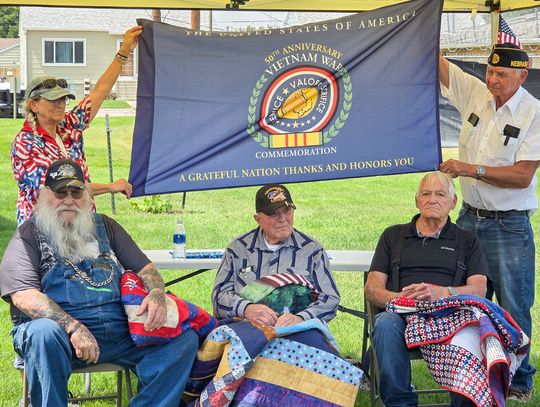 Three receive Quilts of Valor