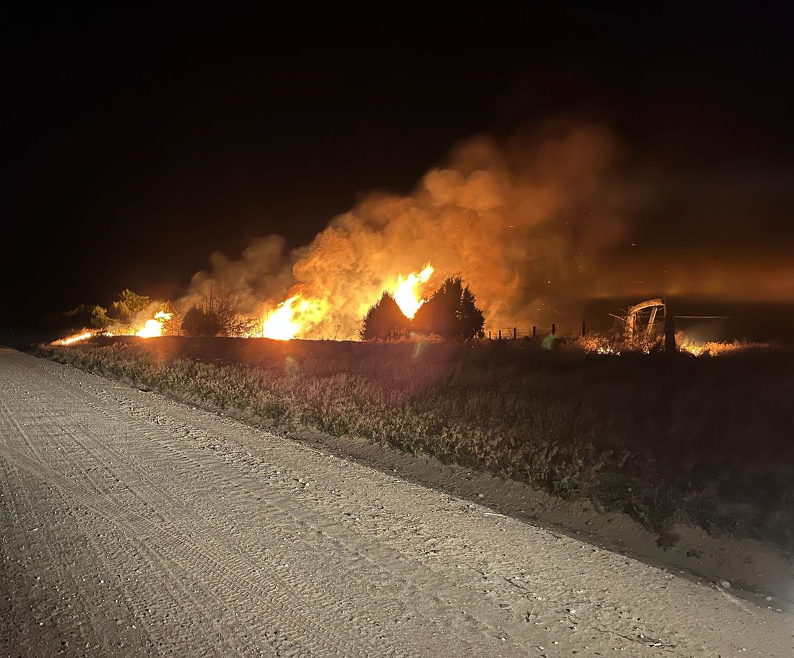 Calm winds helped minimize the spread of flames at a fire on the Kent and Bobbi Wright property southeast of Bridgeport the evening of Thursday