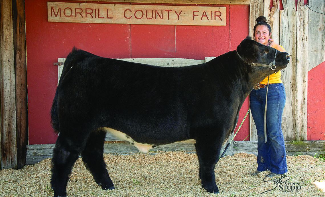 Kelsie McVicker with her Overall Grand Champion Beef