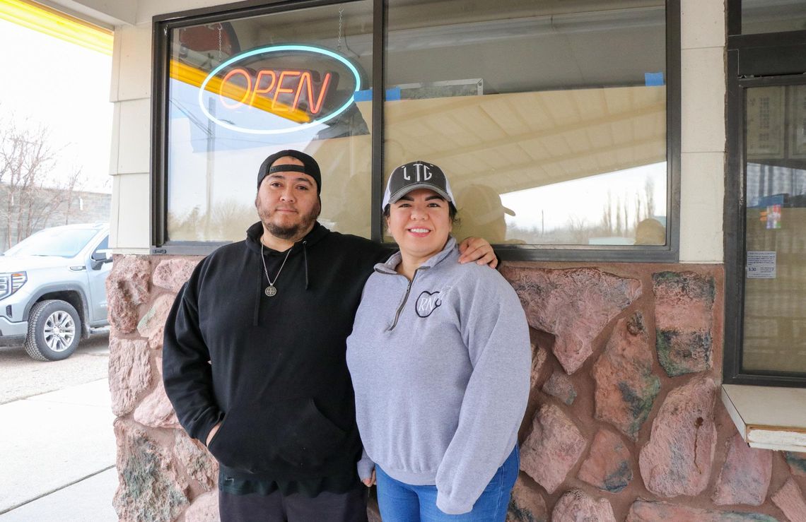 New owners Miguel Torres and Susana Lopez stand in front of Bridgeport’s iconic Karette drive-in on Main Street